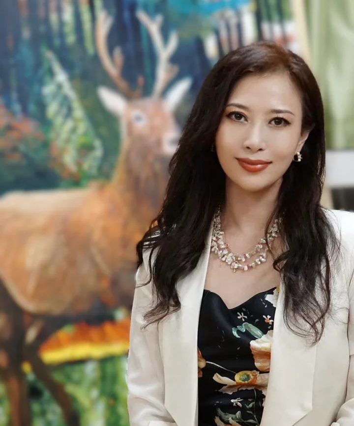 Portrait of KAIXUAN WANG with deer artwork